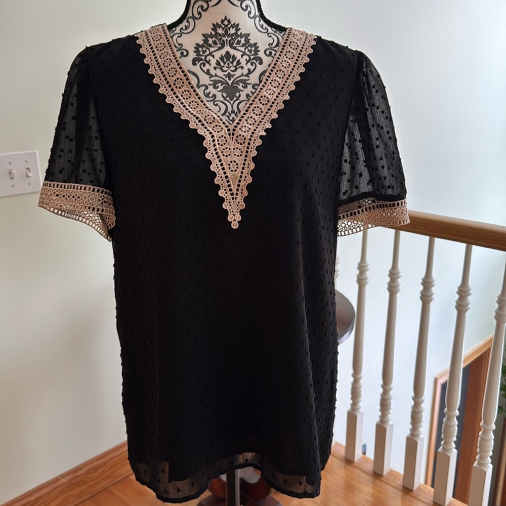 Black top with tan detail